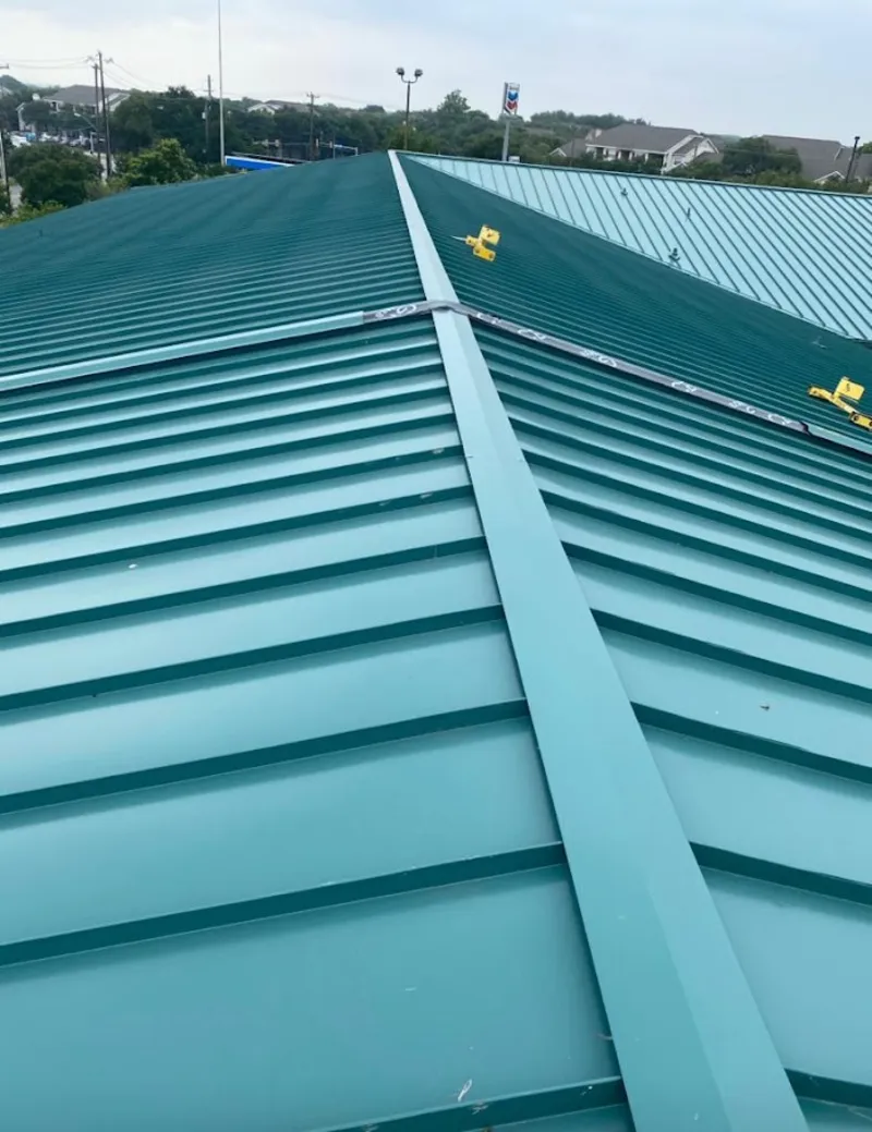 Green commercial metal roof ridge and valley for Metal Roof Repair in Fort Collins